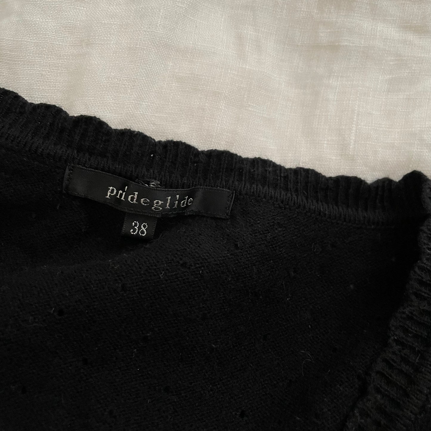 prideglide black cardigan with pink velor contrast bow charms