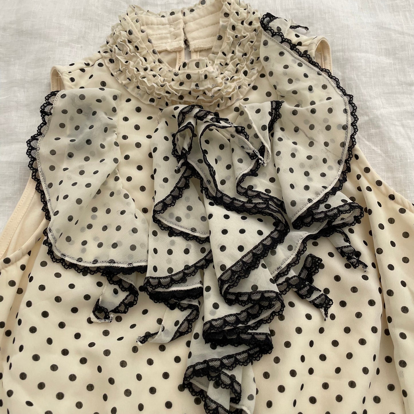 axes femmes cream polka dot ruffle collar blouson vest top