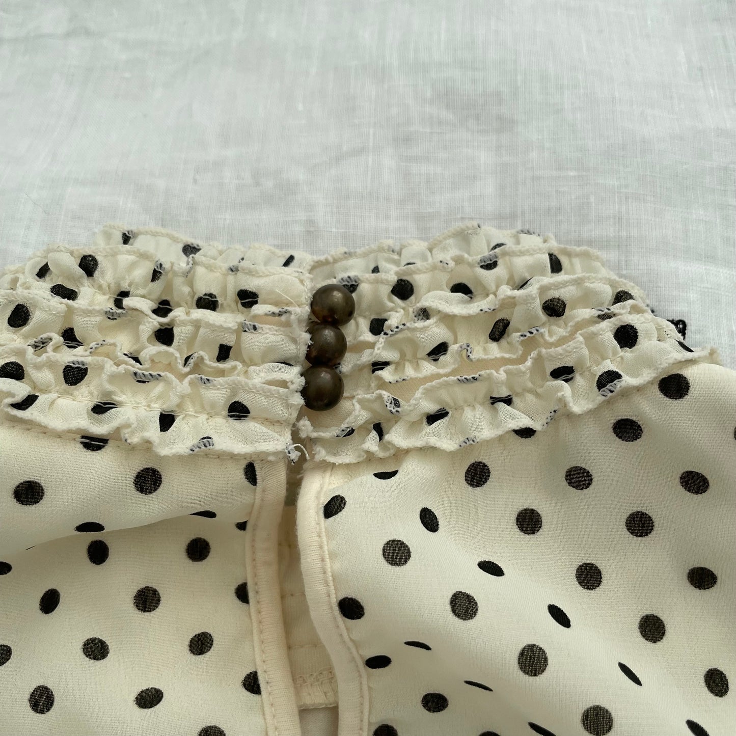 axes femmes cream polka dot ruffle collar blouson vest top