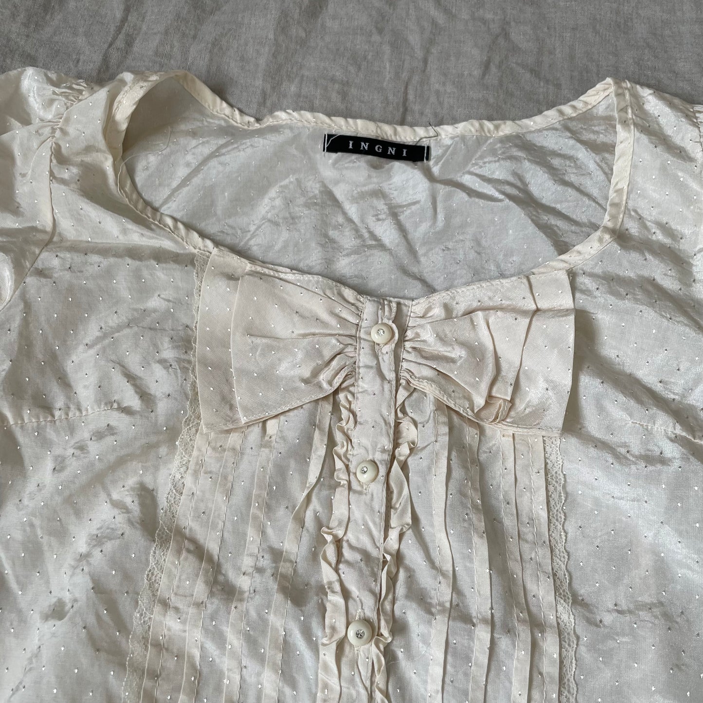 peachy ivory short sleeve coquette polka dot embossed ruffle bow blouse
