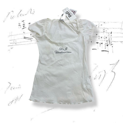 d&g white puff sleeve ribbed shirt with grey italic text and cute bow charms