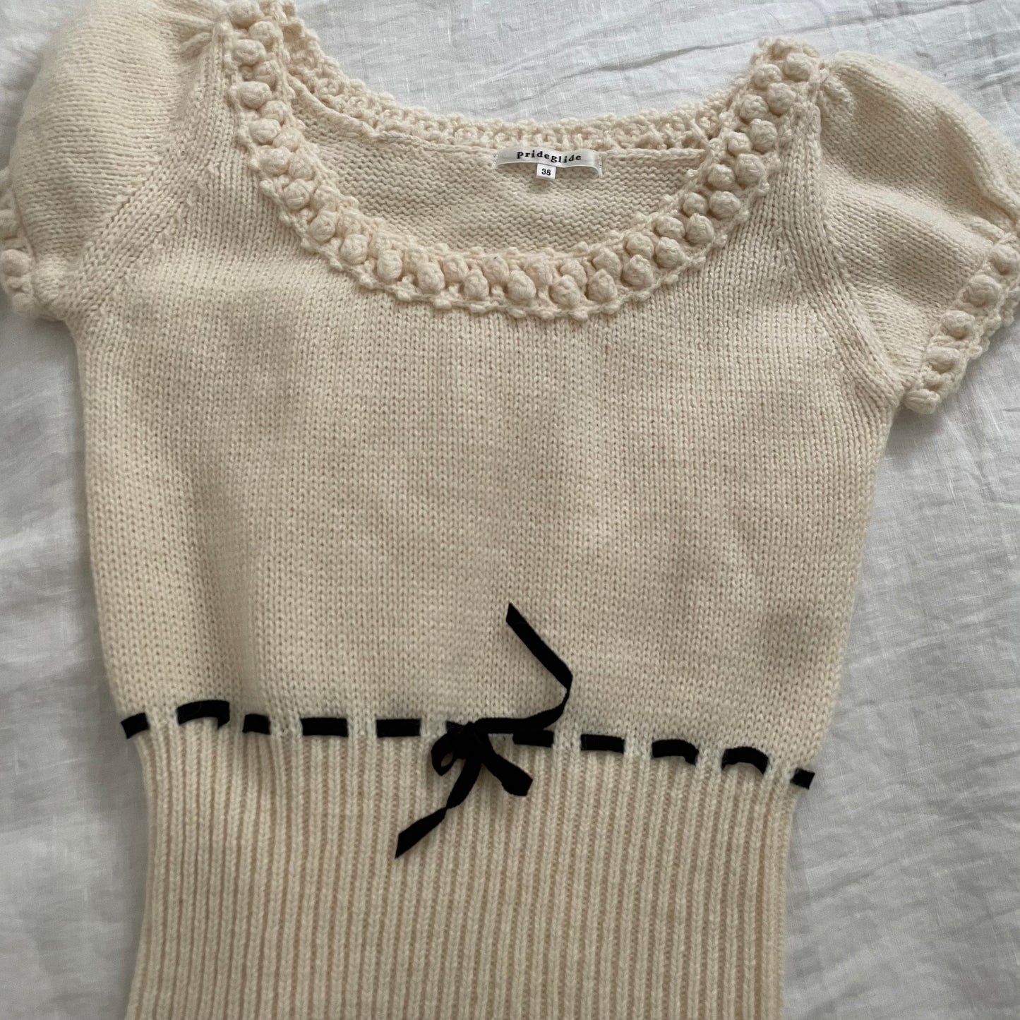 prideglide cream puff sleeve mohair blend knit top with black ribbon waist detail