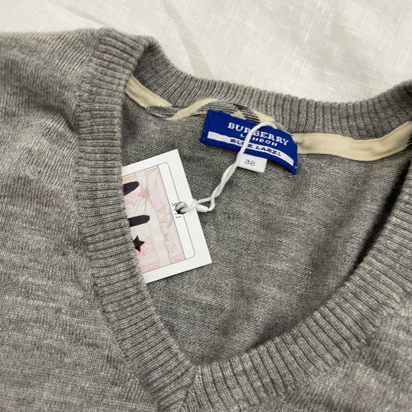 burberry blue label grey ribbed hem v neck sweater with large button detail on the sleeves