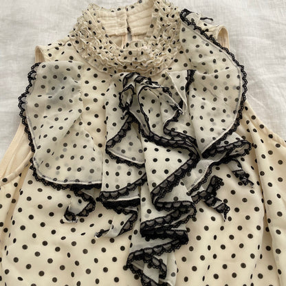 axes femmes cream polka dot ruffle collar blouson vest top
