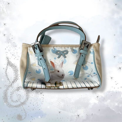 coquette anya hindmarch baby blue x beige rabbit print shoulder bag with bow leather detail