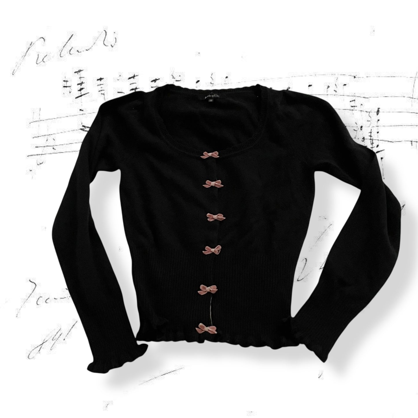 prideglide black cardigan with pink velor contrast bow charms