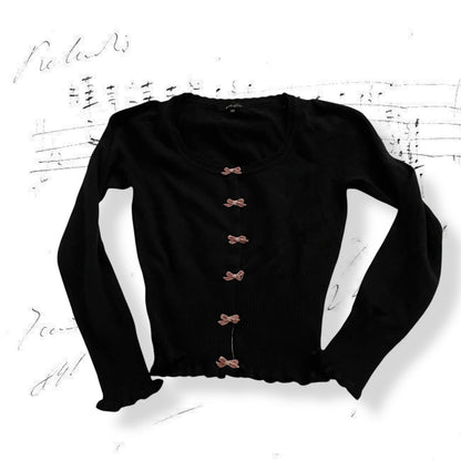 prideglide black cardigan with pink velor contrast bow charms