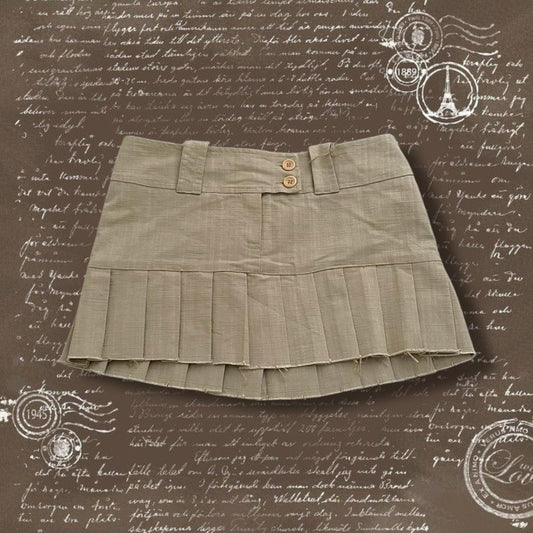 beige onyx preppy pleated drop waist mini skirt with button detail