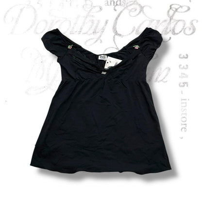 dolce & gabanna dark puff sleeve ruched top with lacey trim, pink rosettes and silver charm detail